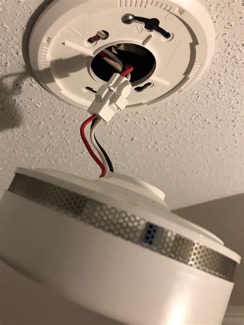 putting a battery smoke alarm over an electrical junction box|battery operated alarm over junction.